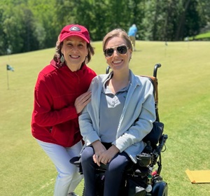 mother and daughter volunteer at golf tournament
