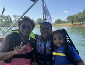 children enjoy time on a boat